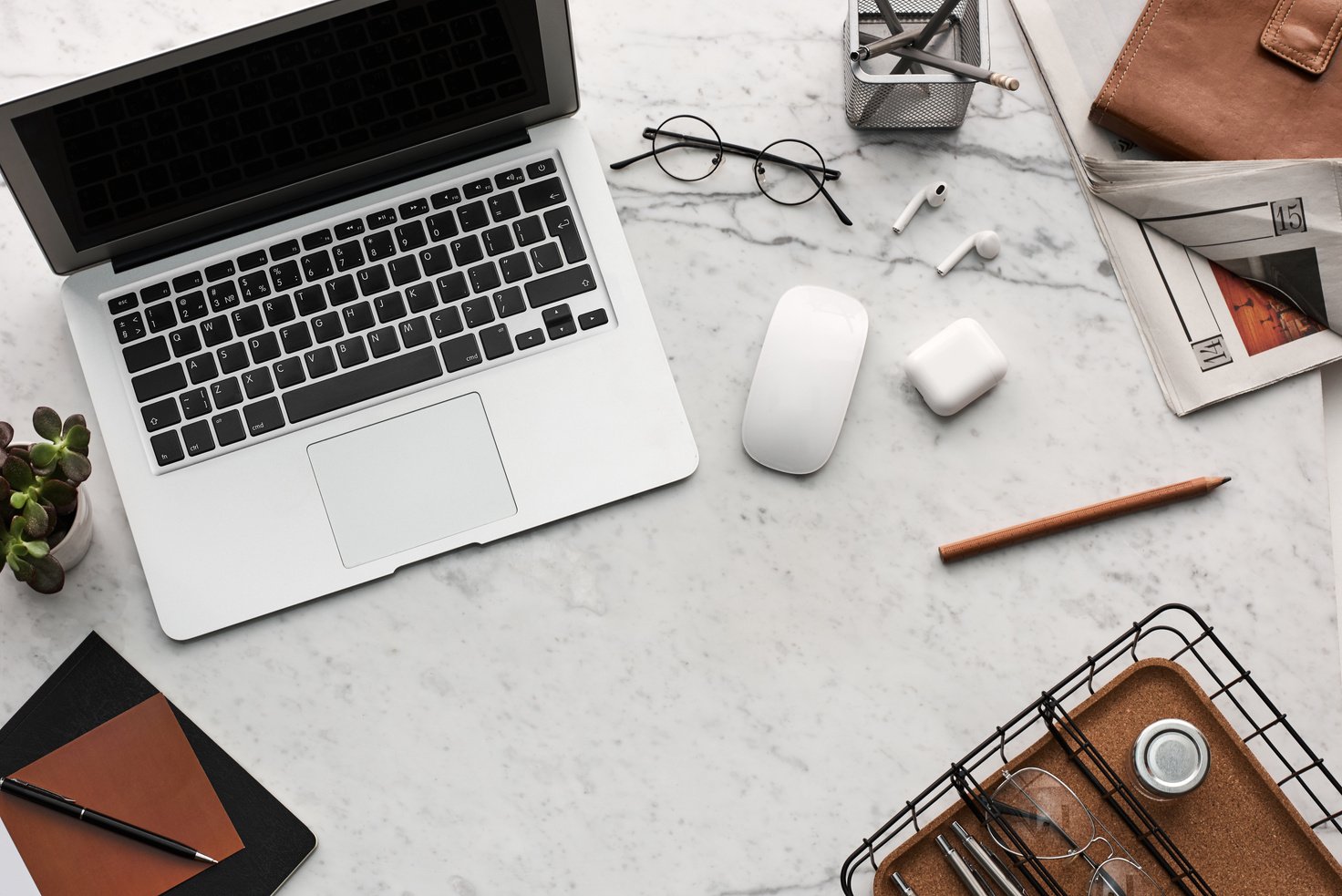 Flatlay Display of Electronics next to Eyeglases